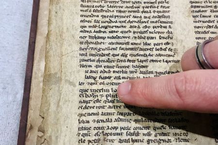 Detail from one of the fragments showing the name "Merlin."