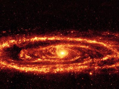 The dust rings of the Andromeda Galaxy stand out in this infrared image taken by the Spitzer Space Telescope. Astronomers have discovered even brighter infrared galaxies that have inspired some imaginative explanations.