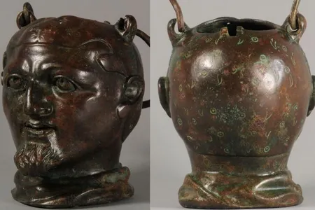 The wrestler's cap alludes to Hercules' defeat of the Nemean lion