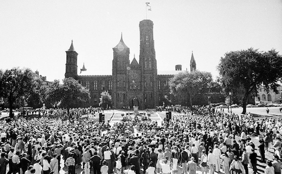A crowd gathers to watch the installation of Secretary Adams in 1984