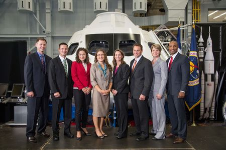 NASA’s 2013 astronaut candidates, nicknamed the “Eight Balls,” pose in front of a mockup of the Orion capsule at the Johnson Space Center in Houston, last August. From left: Tyler Hague, Andrew Morgan, Jessica Meir, Christina Hammock, Nicole Mann, Josh Cassada, Anne McClain, and Victor Glover. 