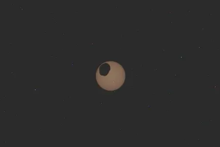 Phobos passes across the sun's surface on February 8, as captured by NASA's Perseverance rover.