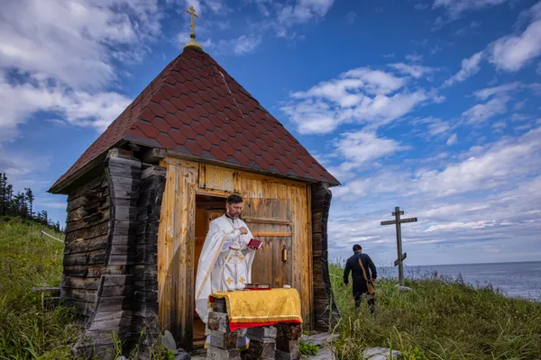 Divine Liturgy on island as a symbol of Russian Orthodoxy thumbnail