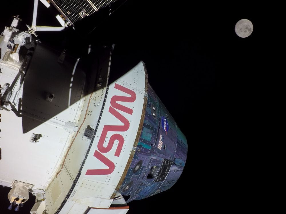 A photo of NASA's Orion spacecraft, with the moon in the background