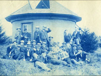 A group poses in front of Michigan State University&#39;s first observatory, circa 1888.