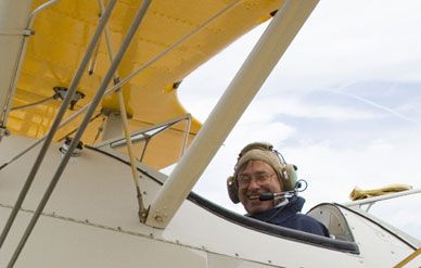 Worden takes the controls of a PT-17 "Kaydet" Stearman biplane during the Collings Foundation Wings of Freedom 2006 tour.