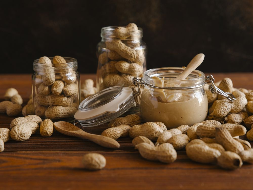 Peanuts and peanut butter on a table