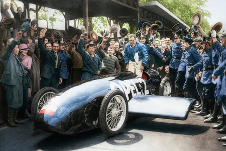Fritz von Opel celebrates a run in his RAK-2 rocket car in Berlin on May 23, 1928. He had the original black-and-white image colorized.