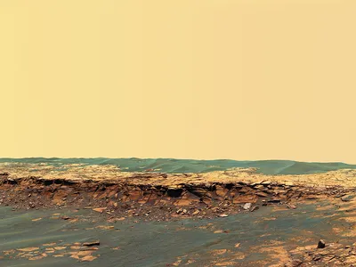 Scene from a desert planet: a panoramic view of the Payson outcrop near the Opportunity rover’s landing site. With its ocean long gone, Mars may yet have liquid reservoirs underground, and spacecraft have seen signs of surface flows. Life, if it ever existed, most likely followed the water.