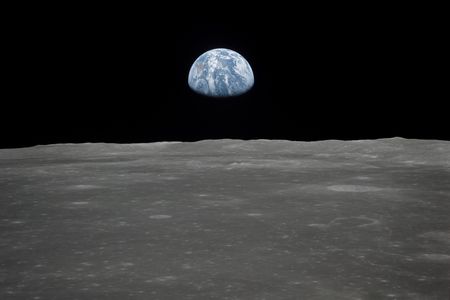 Earth rises over the moon's horizon, as seen from the Apollo 11 spacecraft in 1969.