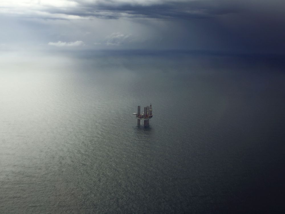 An oil platform sits in the ocean