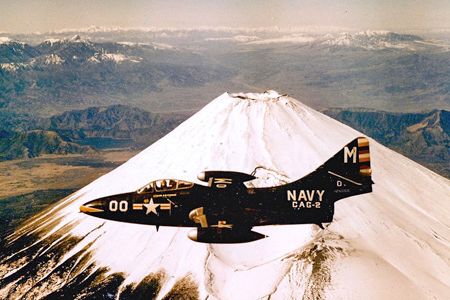 A U.S. Navy F9F Panther assigned to Carrier Air Group 2 cruises past Mount Fuji on a port call in Japan during the Korean War.