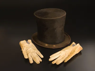Stovepipe hat believed to have belonged to Abraham Lincoln, along with the bloodstained gloves he carried on the night of his assassination.