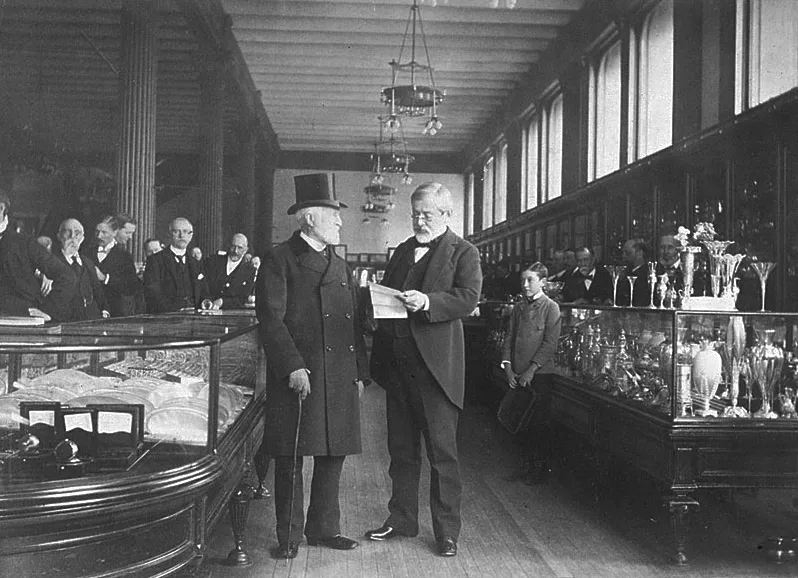 Charles Lewis Tiffany (left) in his store