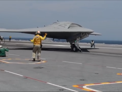 X-47B completes its first unmanned, carrier-based landing.