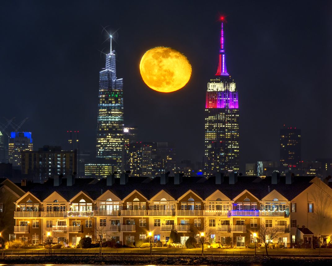 The moon between two New York skyscrapers