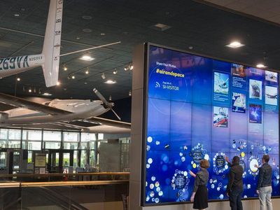 The 16- by 12-foot interactive wall is part of the National Air and Space Museum's new GO FLIGHT digital experience. Visitors to the Mall location can use the wall to create a personalized tour of artifacts. 