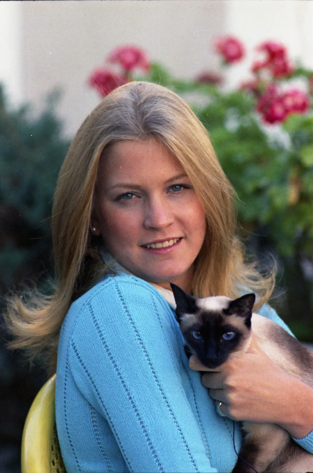 Susan Ford with Shan, a miniature seal point Siamese cat