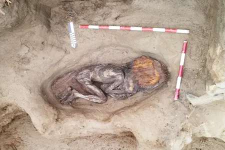 The burial was discovered in the remains of a building in an ancient fishing town.