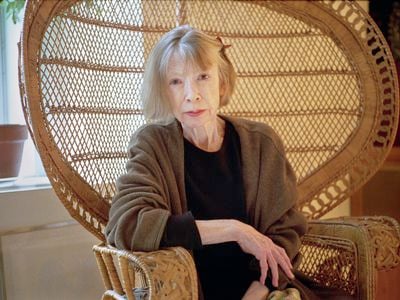 Joan Didion sitting in her wicker chair in 2003. The chair is one of the writer&#39;s many belongings being auctioned on November 16.