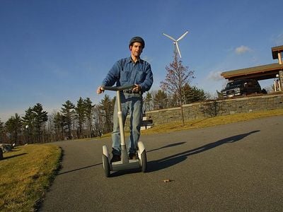 Dean Kamen, inventor of the Segway, rode the self-balancing personal transportation device outside his home in 2002.