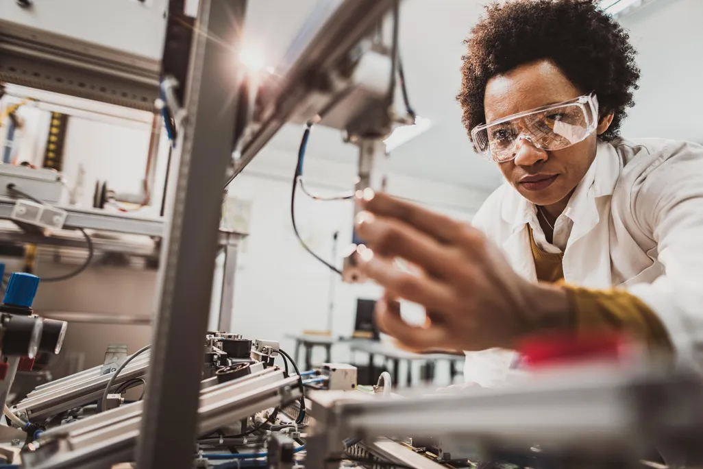Black scientist studying sample