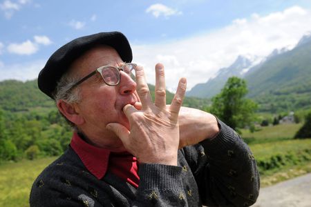 A man in Laruns, southwestern France, whistling as a form of speech. Like others in the Canary Islands and elsewhere, local people have learned to whistle their language to communicate across long distances. Linguists are studying whistled speech to help understand which sound elements are essential to comprehension.