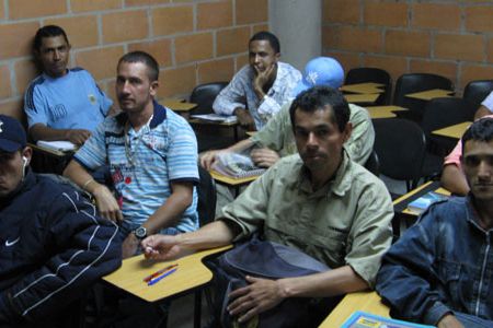 A fifth-grade class of demobilized paramilitary and guerrilla soldiers at Medellin’s Center for Peace and Reconciliation