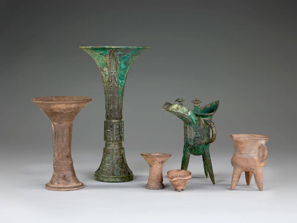 Grouping of bronze wine cups and warmers