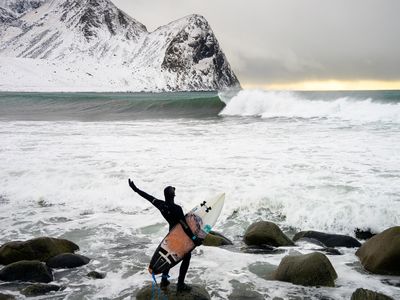Pat Millin eyes an unridden Arctic wave moments before he paddles out