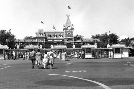 A family walks towards the entrance of Disneyland, circa 1960.