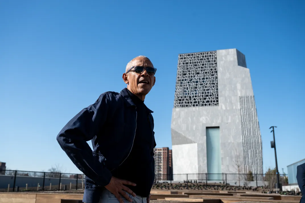 President Barack Obama walking through Obama Presidential Center