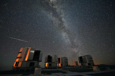 A meteor from the Perseids is seen falling over the Very Large Telescope array in Chile.