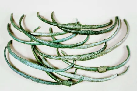 Similar in weight and appearance, these Bronze Age ribs, or curved rods, may have been used as an early form of money.