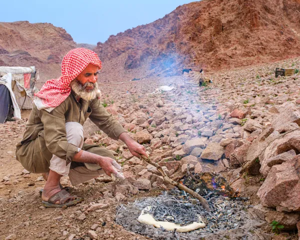 Bedouin Making Flat Bread ("abud") in Traditional Manner thumbnail