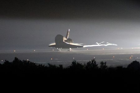 Endeavour's end: Mark Kelly lands the shuttle at Kennedy Space Center to close the STS-134 mission.