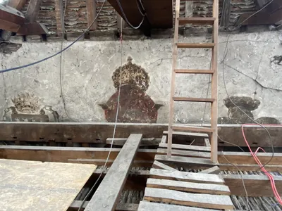 Found by workers during recent restorations, the wall paintings feature three crowned motifs.