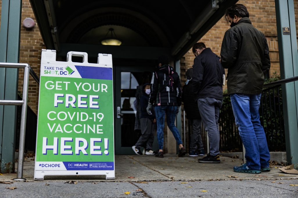 People wait in line for Covid-19 vaccinations in Washington, D.C.