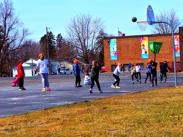 Basketball Game in School Yard thumbnail