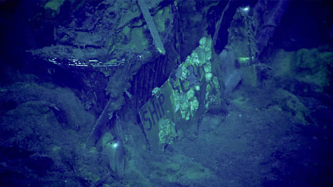 Underwater view of car's front plate