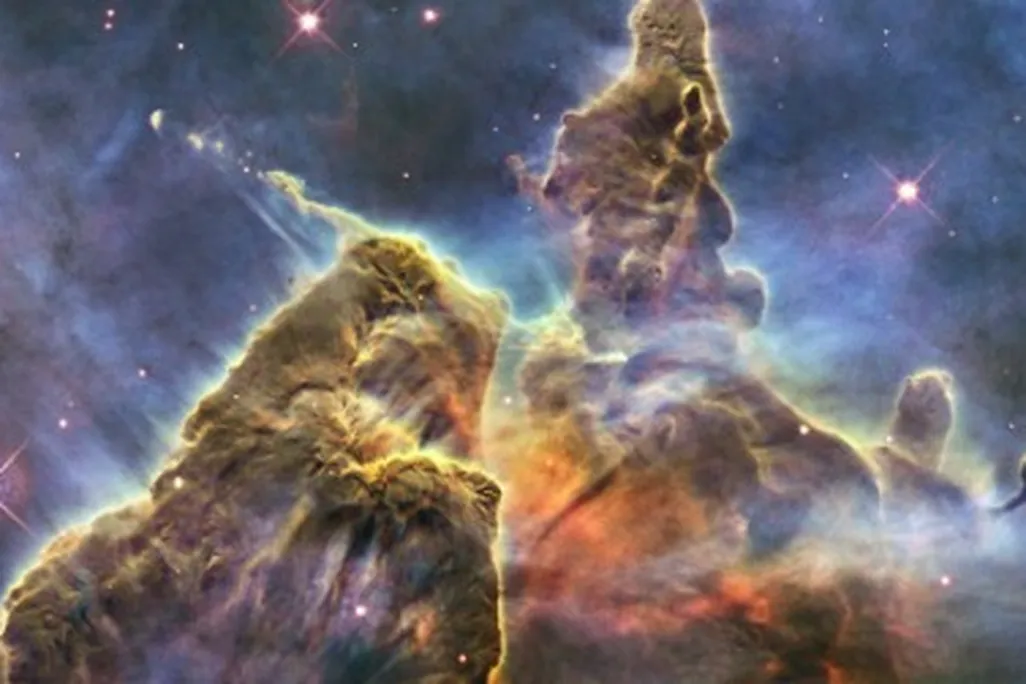 A budding star spits out jets of superheated gas and dust in the Carina Nebula