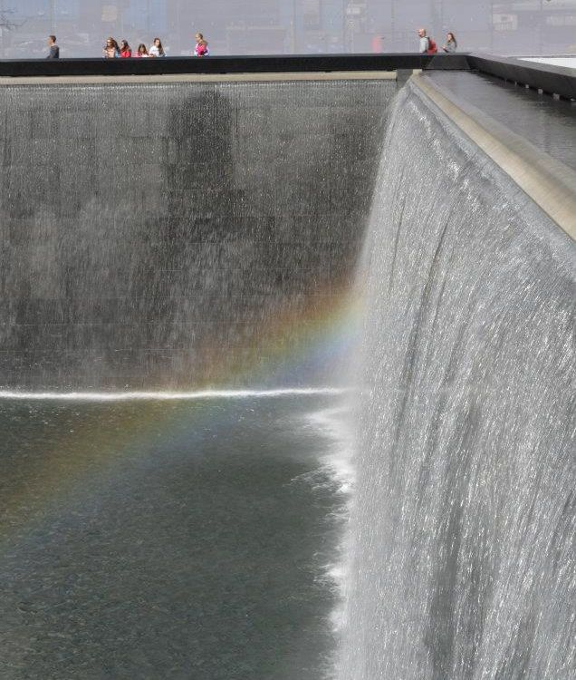 Rainbow formed from the waterfall in the 9/11 memorial at ground zero