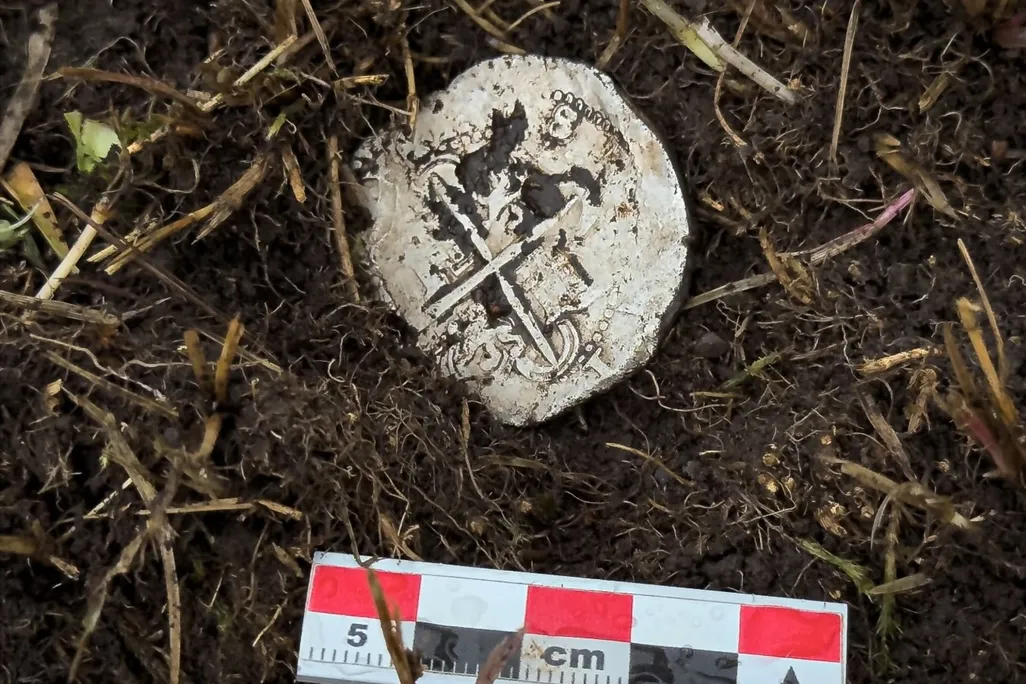 Coin in the dirt