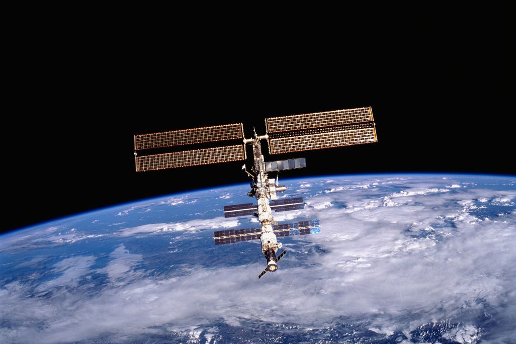 A photo of the International Space Station with the Earth in the background