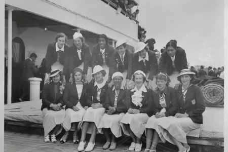 A few of the Olympians pose for a photo upon their return to the U.S. after the 1936 Games. In the back row, on the far right is Tidye PIckett and third from the left is Louise Stokes.