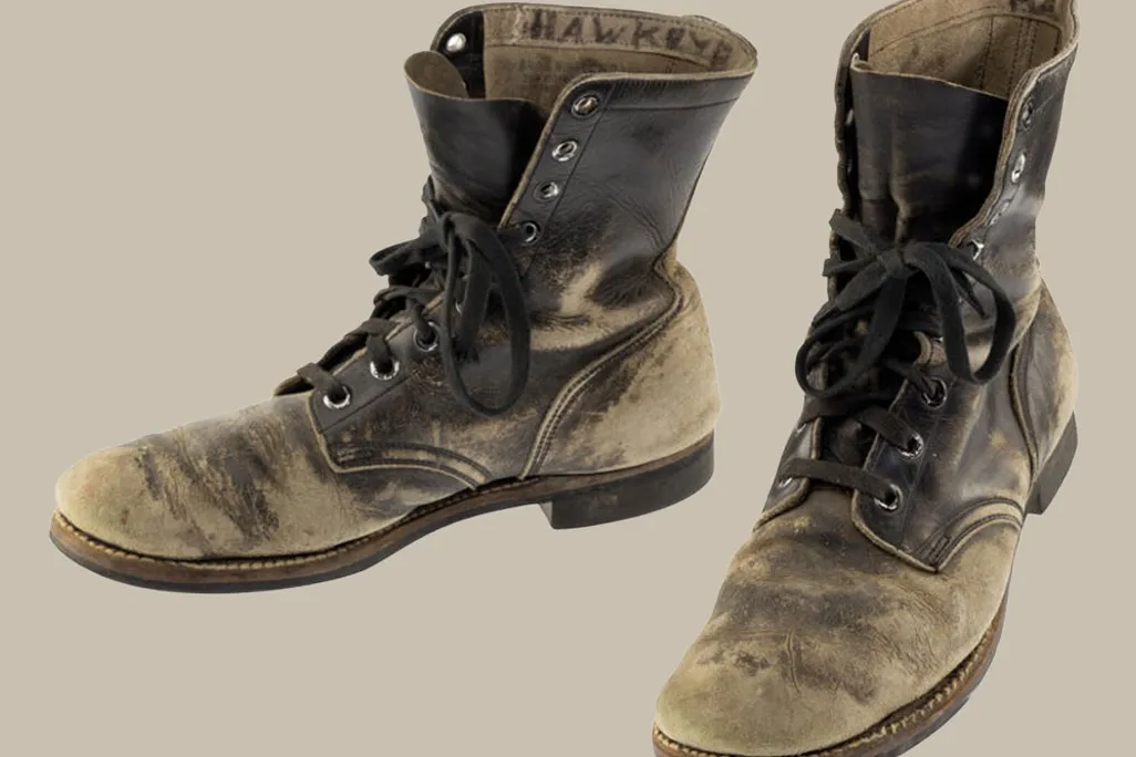 Alan Alda's scuffed combat boots