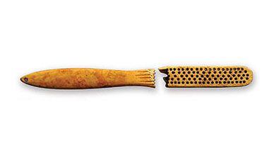 Among items the archaeologists unearthed were a toothbrush (above) and a gaming die . The artifacts now repose in 630 boxes.