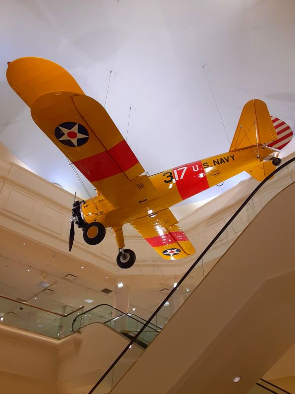 U.S. Navy Biplane in Von Maur store. thumbnail