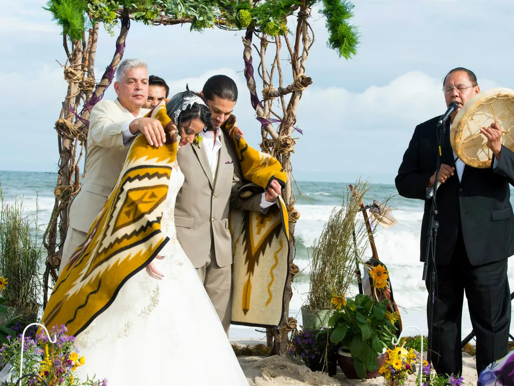 An Indigenous couple marries on the beach at Assateague Island National Seashore and Assateague State Park. Many of the United States' National Parks are places of historical, cultural, and sacred meaning for Native communities. (Photo used with the permission of Desirée Shelley Flores)