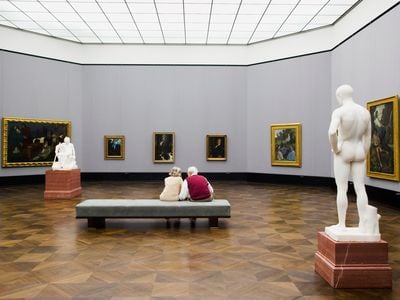 People view a painting at the Altes Museum in Germany. As populations age and address various health challenges, museums are increasingly tailoring their programming to better serve their patrons.